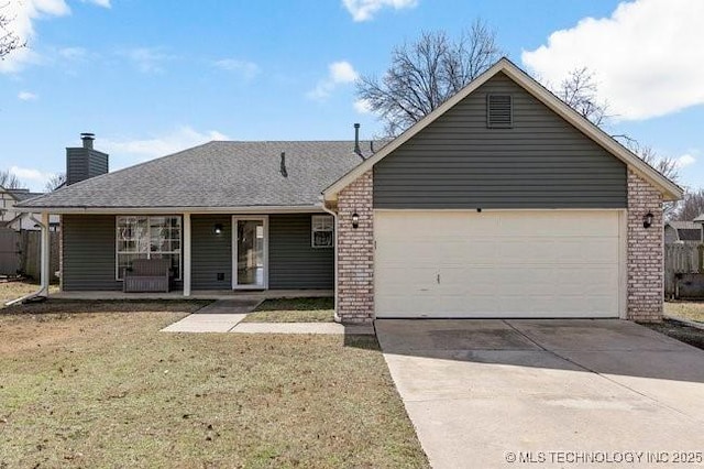 single story home featuring a garage, brick siding, concrete driveway, a chimney, and a front yard