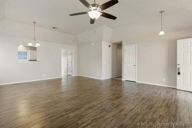 unfurnished living room featuring dark wood-type flooring, baseboards, and ceiling fan with notable chandelier