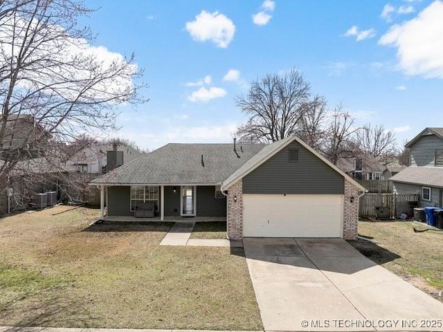 ranch-style house with covered porch, a garage, brick siding, driveway, and a front lawn