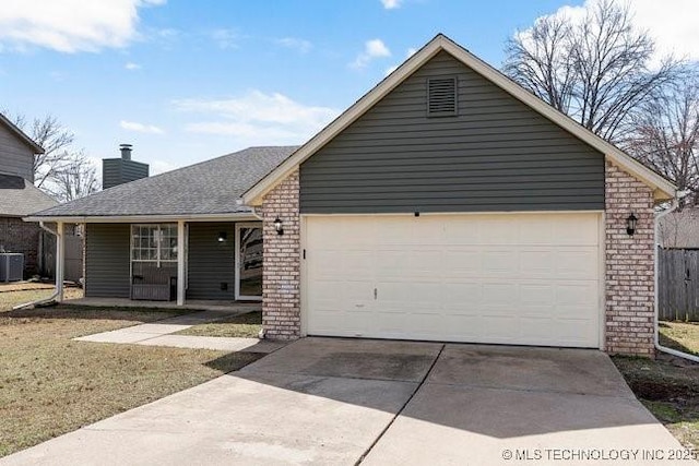 ranch-style home with a garage, concrete driveway, brick siding, and central air condition unit