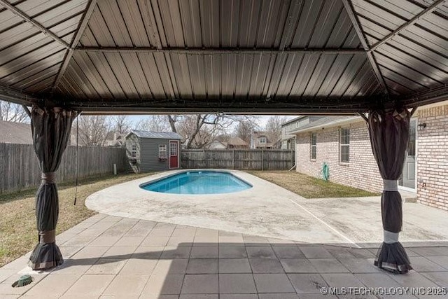 view of pool with a gazebo, a patio, and a fenced backyard