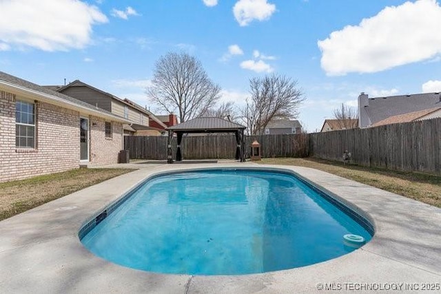 view of swimming pool with a gazebo, a patio area, a fenced backyard, and a fenced in pool