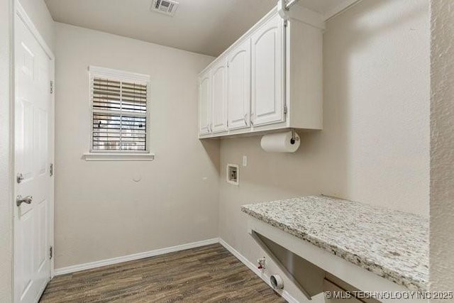 clothes washing area featuring washer hookup, visible vents, baseboards, cabinet space, and dark wood-style floors