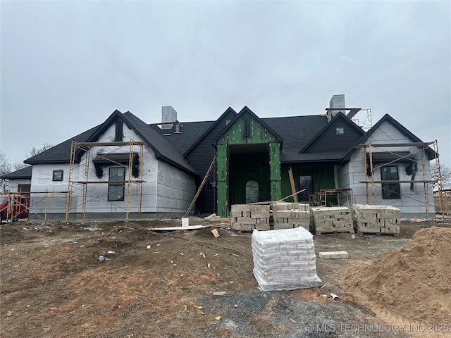 property under construction featuring a chimney and central AC