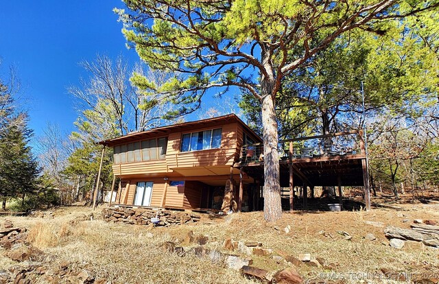 view of front facade with a wooden deck