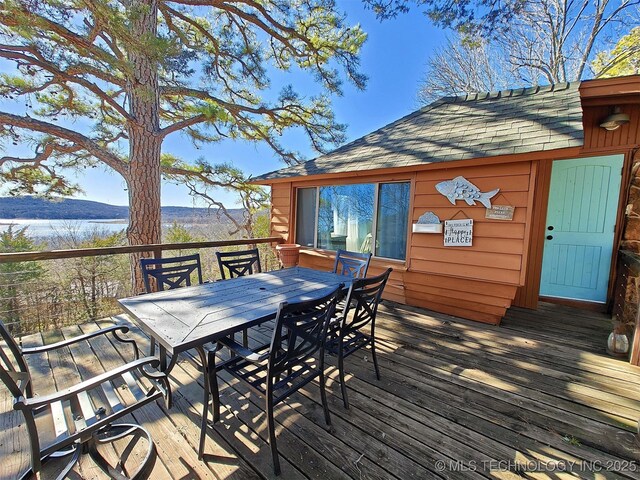 wooden deck featuring outdoor dining space