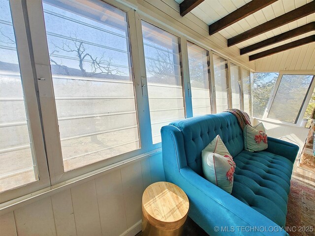 sunroom / solarium with vaulted ceiling with beams and wood ceiling