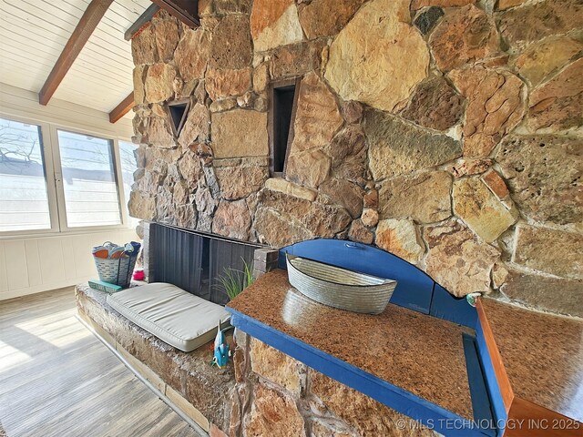 room details with wood ceiling, beam ceiling, and wood finished floors