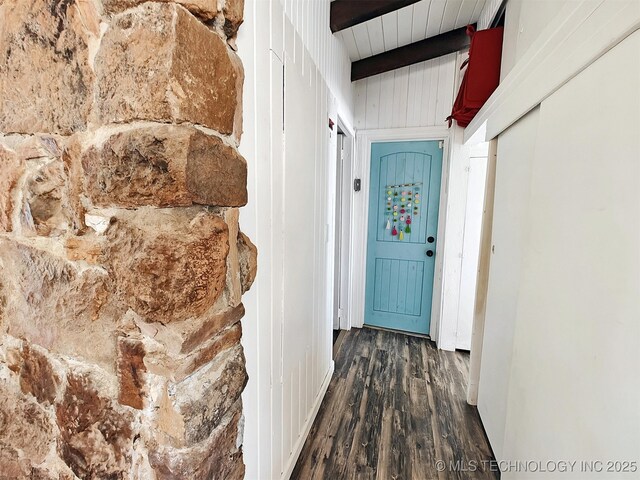 hallway with beamed ceiling and wood finished floors