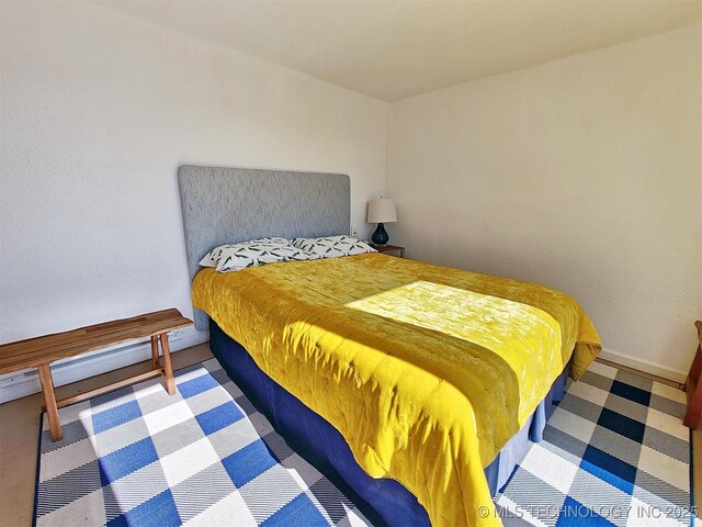 bedroom featuring baseboards