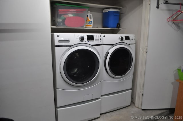 laundry room featuring washer and dryer and laundry area