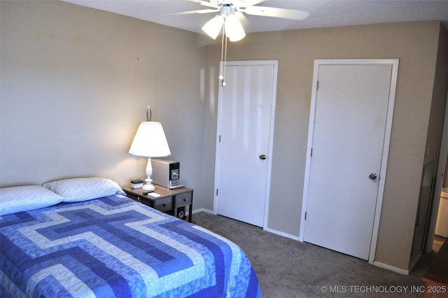 bedroom with carpet floors, a closet, baseboards, and a ceiling fan