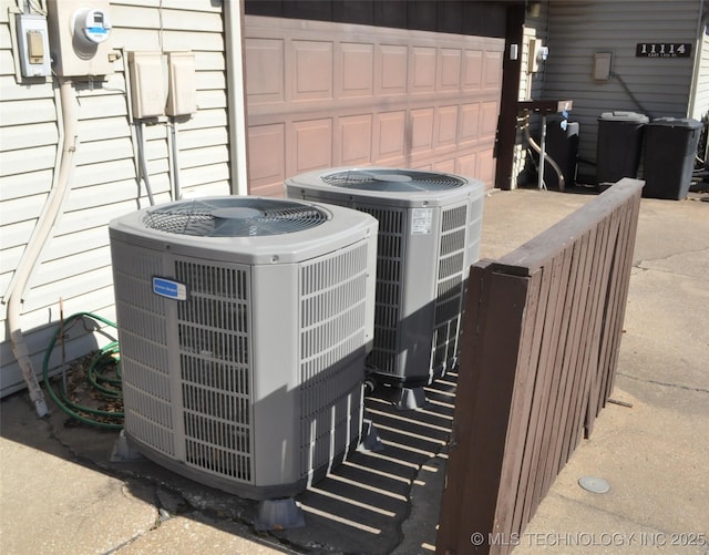 exterior details with electric meter and central air condition unit