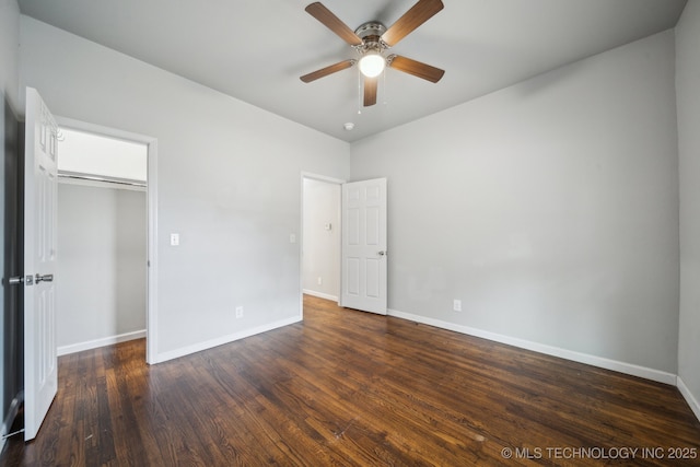 unfurnished bedroom with a closet, ceiling fan, baseboards, and wood finished floors