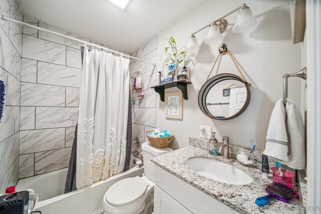 full bathroom with toilet, vanity, and shower / bathtub combination with curtain