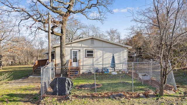 view of home's exterior with a yard and a fenced front yard