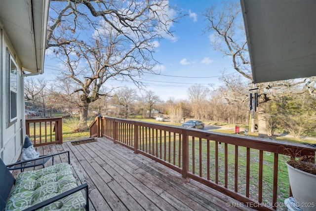 wooden deck with a yard