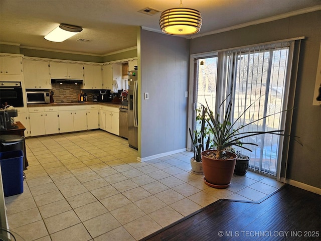 kitchen with visible vents, decorative backsplash, ornamental molding, white cabinetry, and black appliances