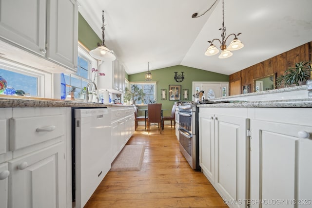 3126 E 490th Rd, Pryor, OK 74361 - kitchen with white cabinets, white dishwasher, an inviting chandelier, light wood-style floors, and range with two ovens