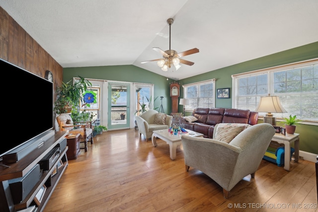 3126 E 490th Rd, Pryor, OK 74361 - living room featuring a healthy amount of sunlight, light wood-style floors, a ceiling fan, and vaulted ceiling