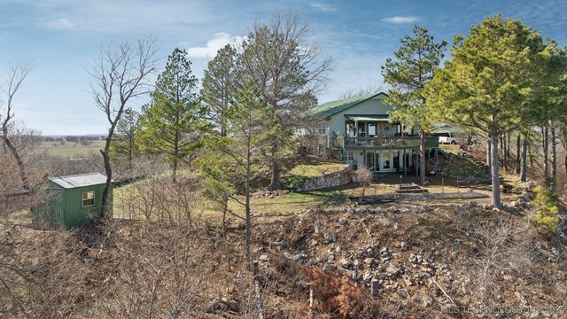 3126 E 490th Rd, Pryor, OK 74361 - view of yard featuring an outdoor structure, a wooden deck, and stairway
