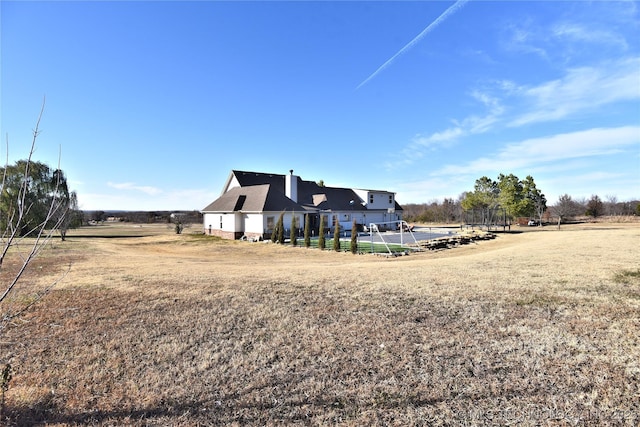 rear view of property featuring a rural view