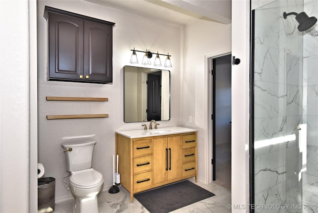 full bath featuring toilet, marble finish floor, a marble finish shower, and vanity