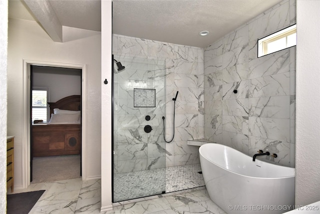 ensuite bathroom featuring marble finish floor, a marble finish shower, a soaking tub, ensuite bathroom, and a textured ceiling