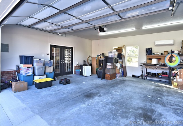 garage featuring an AC wall unit, french doors, and a garage door opener