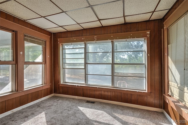 unfurnished sunroom featuring visible vents and a paneled ceiling