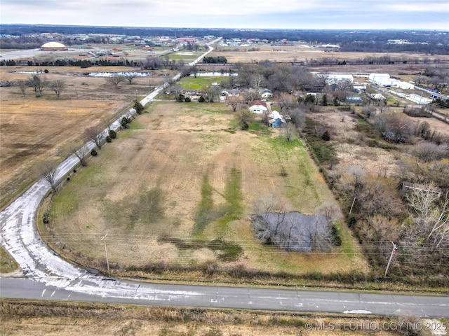 birds eye view of property featuring a rural view