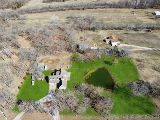 birds eye view of property with a rural view