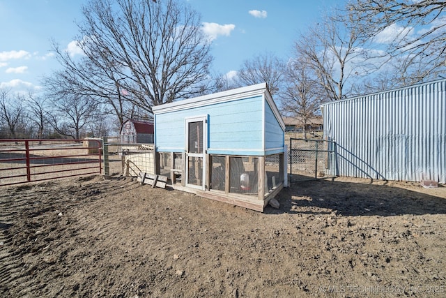 view of poultry coop featuring fence