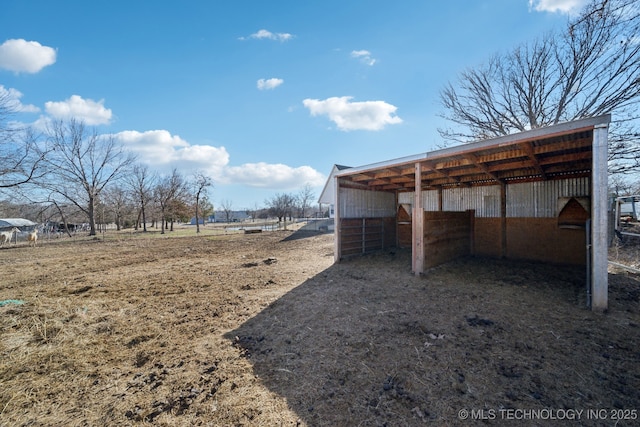 view of yard with a carport and an outdoor structure