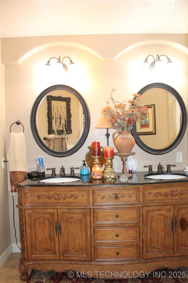 bathroom featuring double vanity and a sink