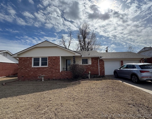 ranch-style home with concrete driveway, brick siding, roof with shingles, and an attached garage