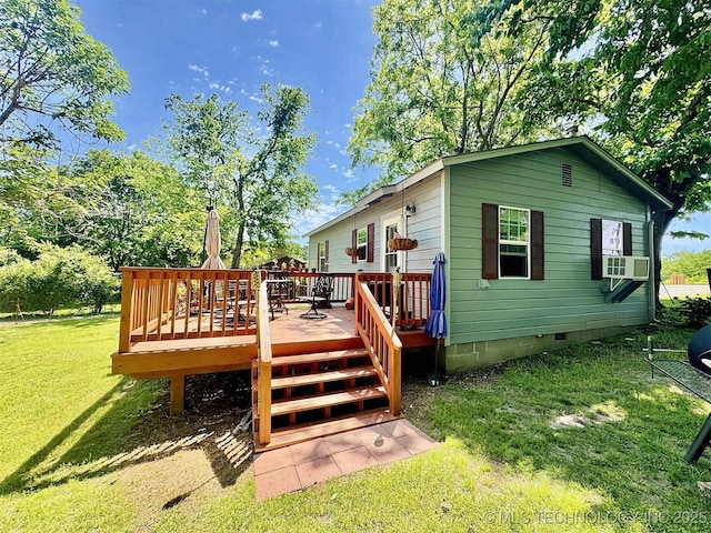117 S Bluff Ave, Tahlequah, OK 74464 - rear view of property featuring crawl space, a lawn, a wooden deck, and cooling unit