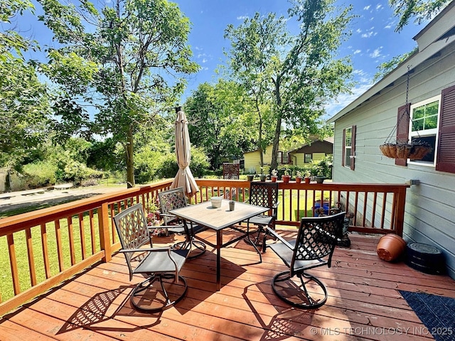 117 S Bluff Ave, Tahlequah, OK 74464 - deck with outdoor dining area and a yard