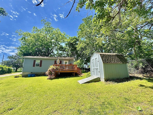 117 S Bluff Ave, Tahlequah, OK 74464 - view of yard featuring a shed, a deck, and an outdoor structure