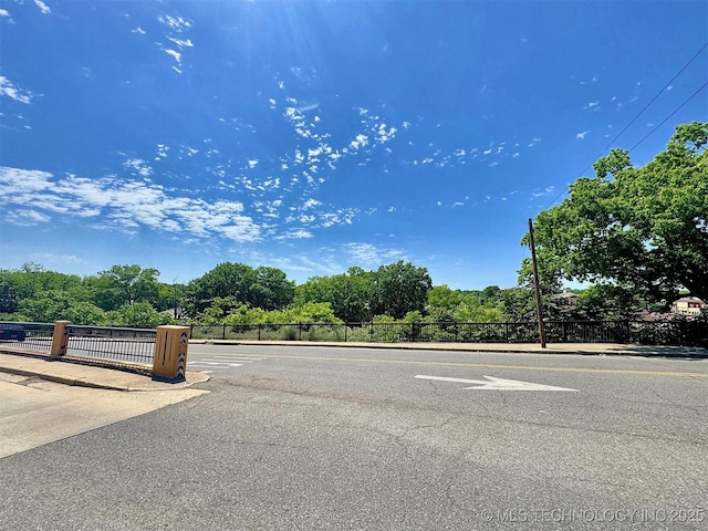 117 S Bluff Ave, Tahlequah, OK 74464 - view of asphalt street featuring view of wooded area
