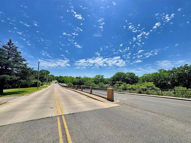117 S Bluff Ave, Tahlequah, OK 74464 - view of asphalt road with view of wooded area