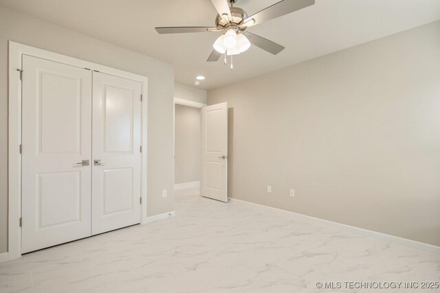 unfurnished bedroom featuring a ceiling fan, baseboards, a closet, marble finish floor, and recessed lighting