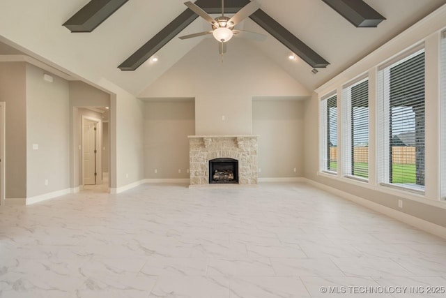 unfurnished living room featuring a ceiling fan, high vaulted ceiling, beam ceiling, and marble finish floor
