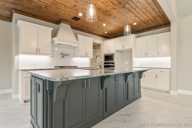 kitchen featuring marble finish floor, premium range hood, wooden ceiling, a sink, and stainless steel appliances