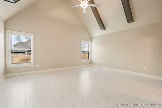 spare room featuring baseboards, a ceiling fan, marble finish floor, and high vaulted ceiling