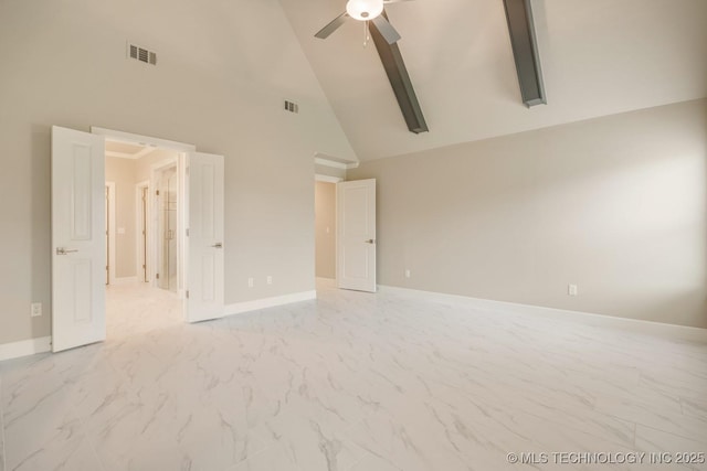 empty room featuring a ceiling fan, high vaulted ceiling, visible vents, and marble finish floor