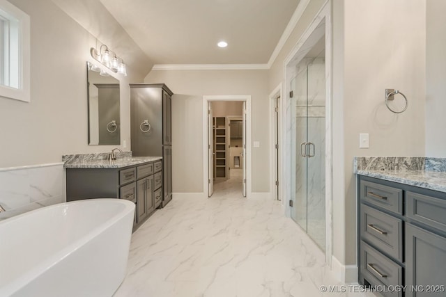 full bath with a freestanding bath, vanity, marble finish floor, a marble finish shower, and ornamental molding