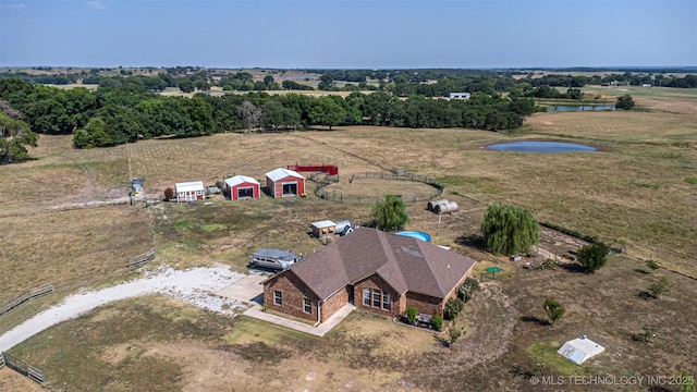 bird's eye view featuring a water view and a rural view