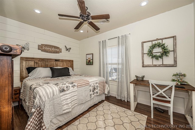 bedroom featuring recessed lighting, ceiling fan, wooden walls, and wood finished floors