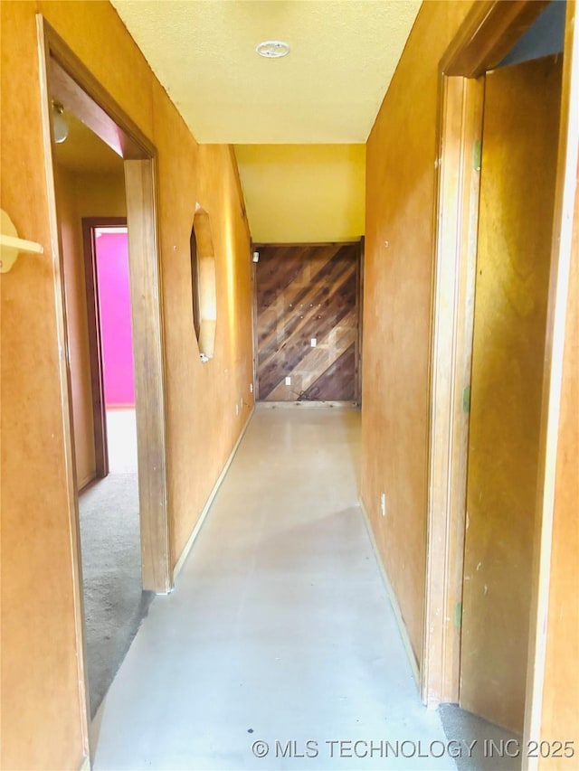 corridor with finished concrete flooring